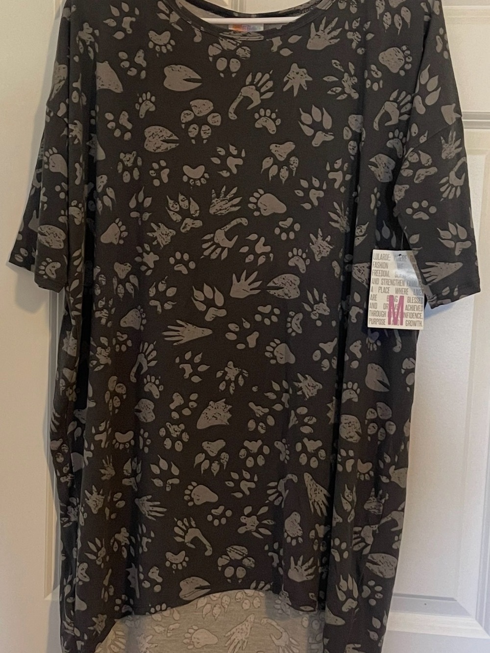 LuLaRoe Irma Black Short Sleeve Tee with Gray Paw-Print Pattern